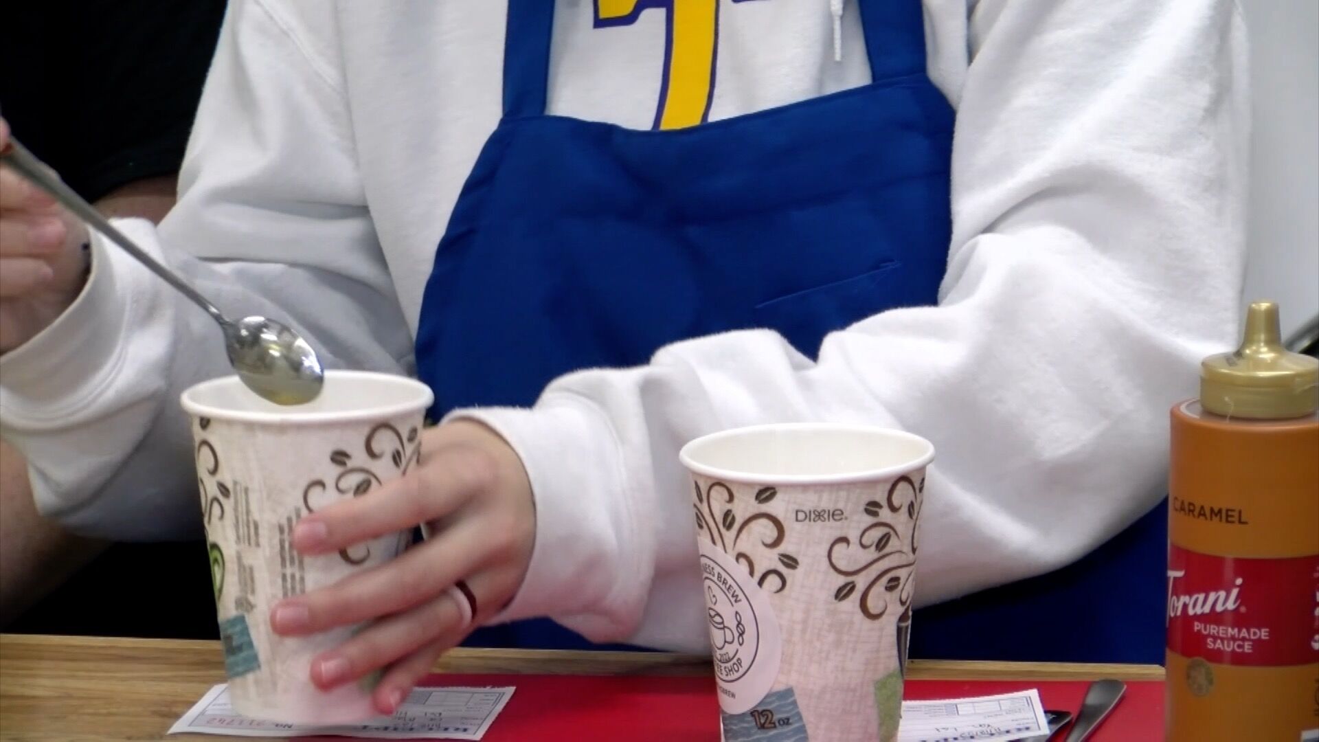 Tupelo High School students operating on-campus coffee shop.